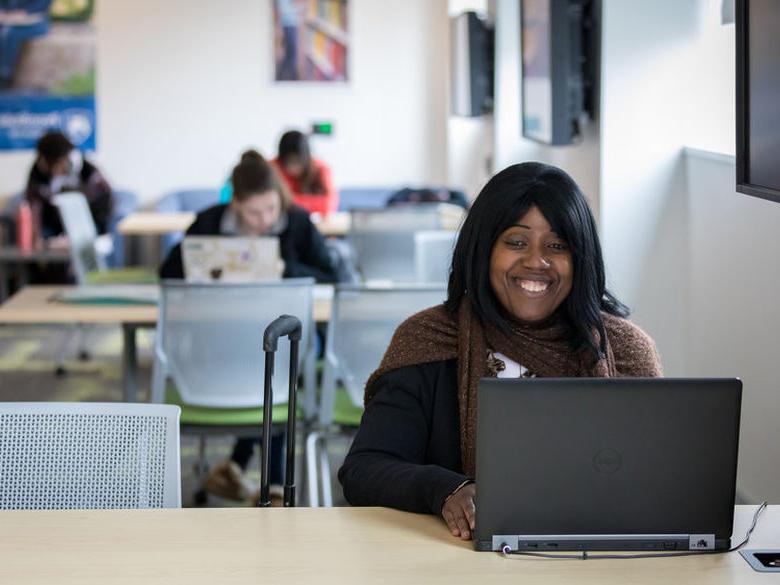 Female student working on a laptop